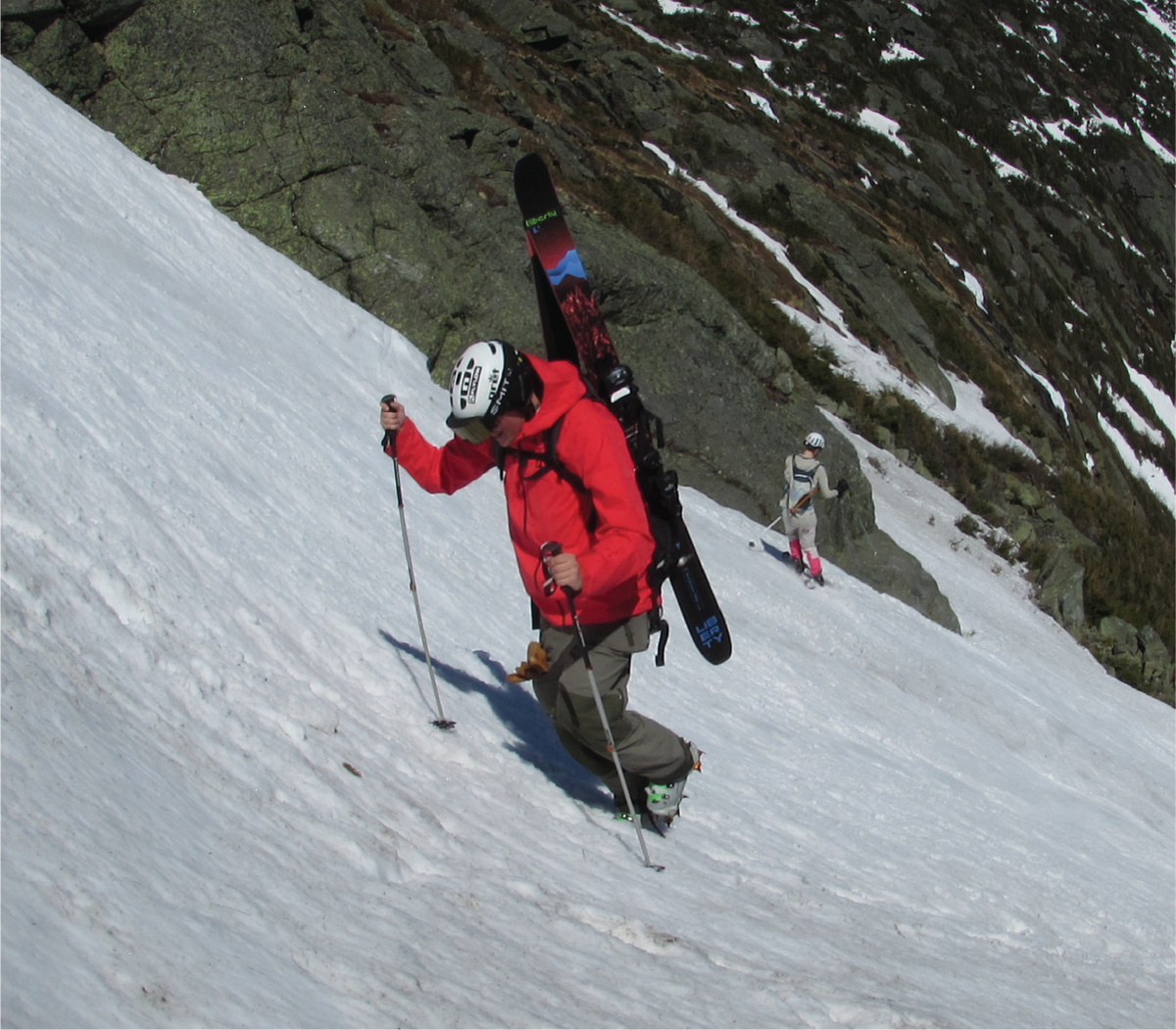 Skier riding Liberty Radian 100 skis on snow