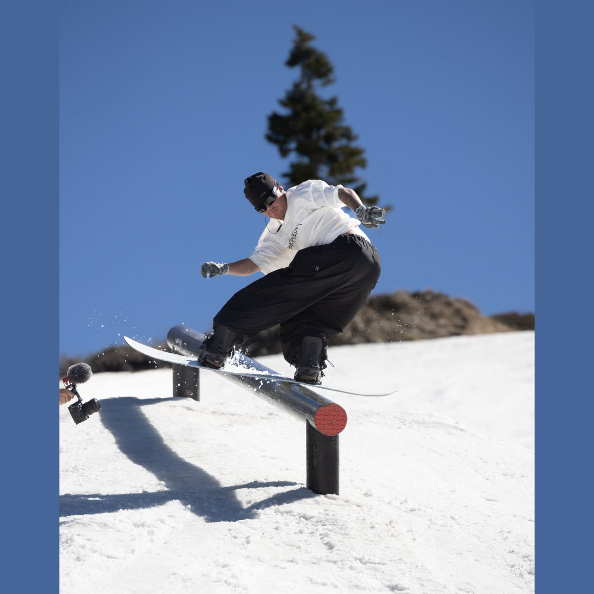 Bataleon Evil Twin Men's Snowboard 2026/27 — rider sliding a park rail