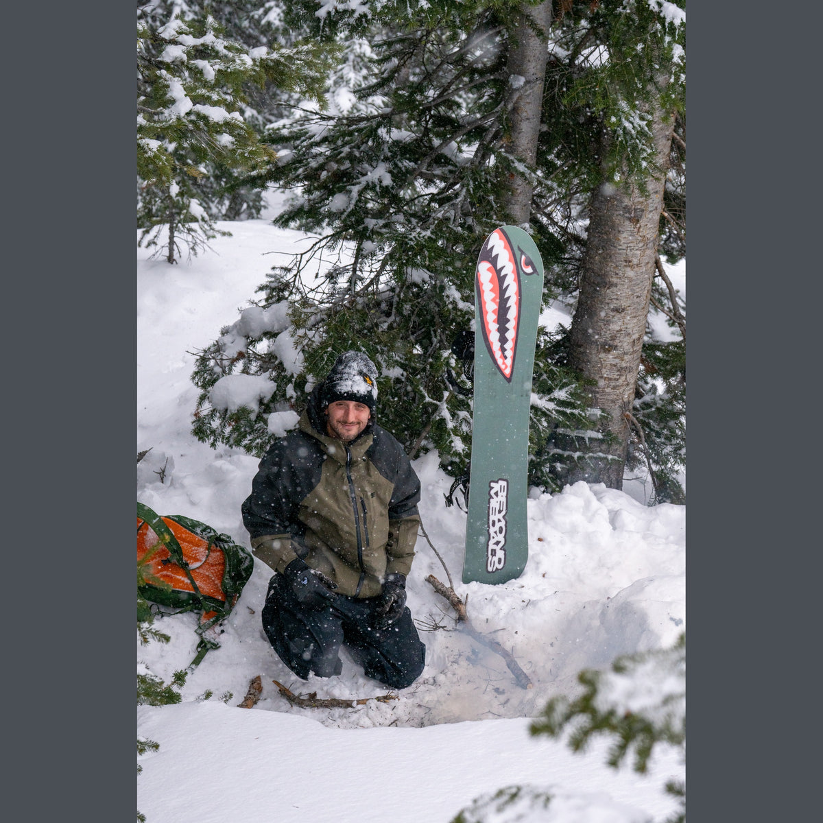 Bataleon Tornado x Beyond Medals 2026/27 — rider holding the board in the snow