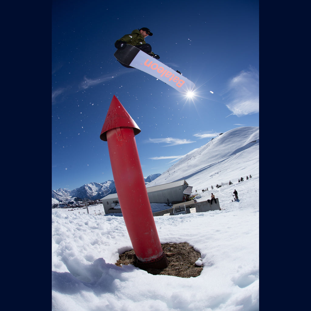 Bataleon Whatever Snowboard 2026/27 — rider grabbing the board in a jump
