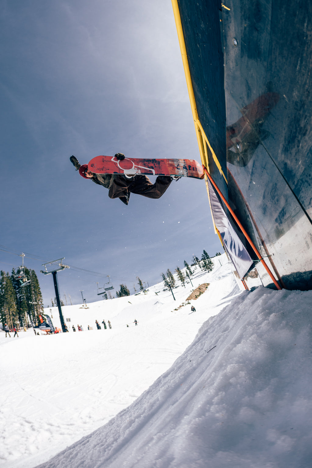 Mike Rav riding a CAPiTA Ultrafear above a park wall; photo by Neil DaCosta