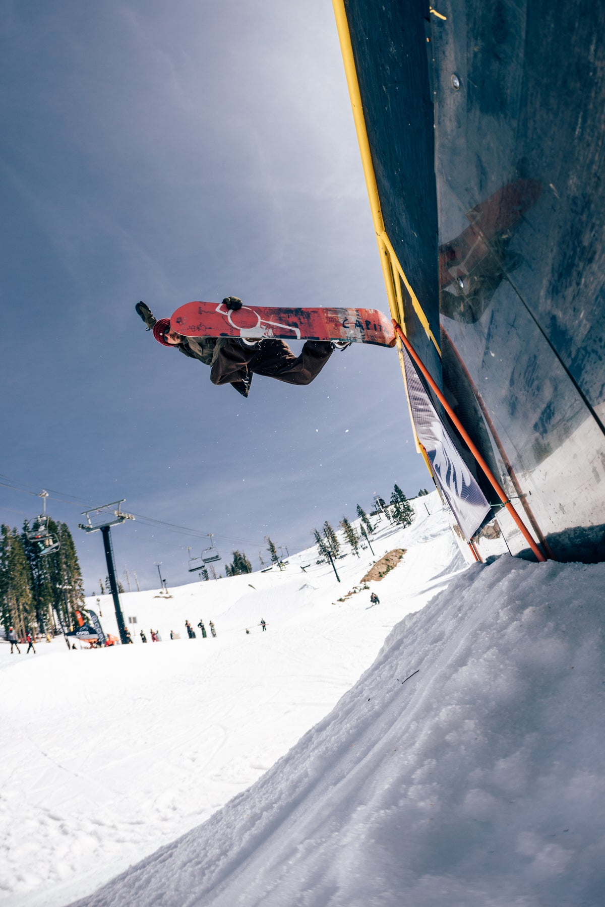 Mike Rav riding a CAPiTA Ultrafear above a park wall; photo by Neil DaCosta
