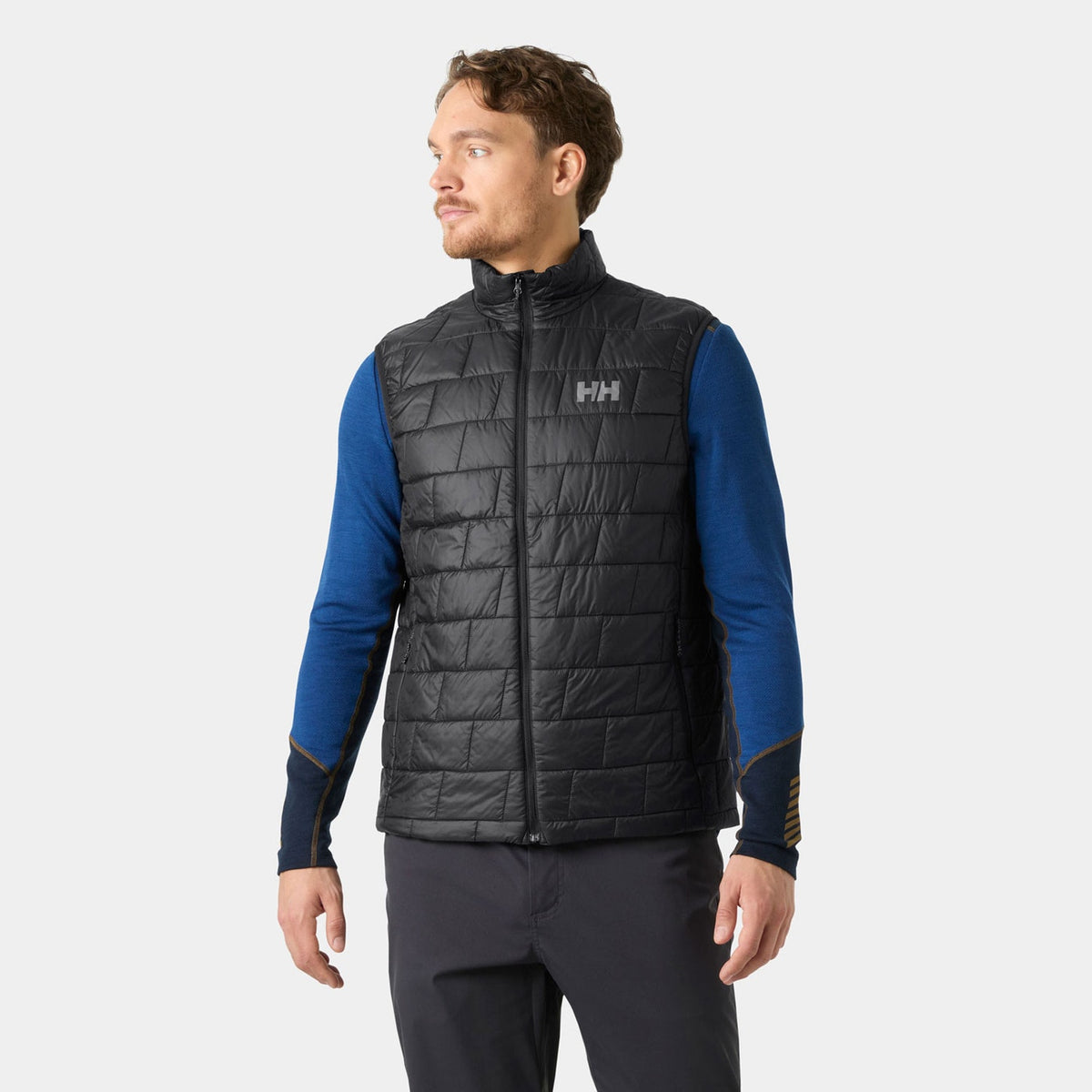 Helly Hansen Men's LIFALOFT Insulator Vest in Black, on model view. Photo: Helly Hansen