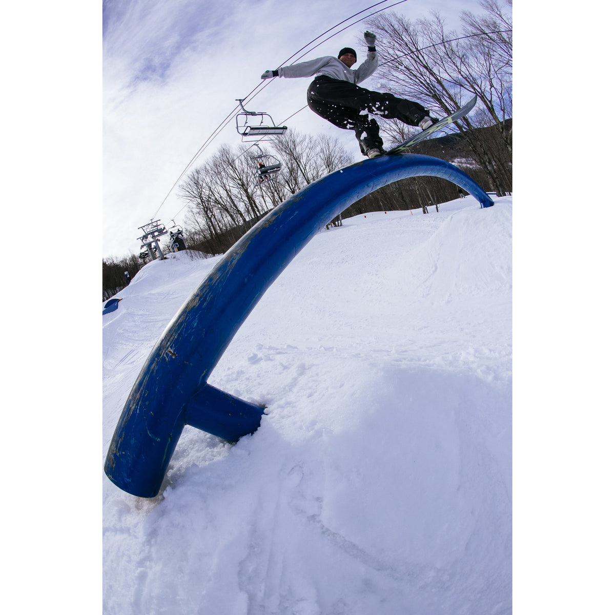 Rome Artifact 2027 snowboard ridden on a park rail