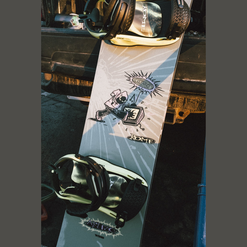 Rome Artifact Men's Snowboard 2026/27 — mounted board photographed outdoors
