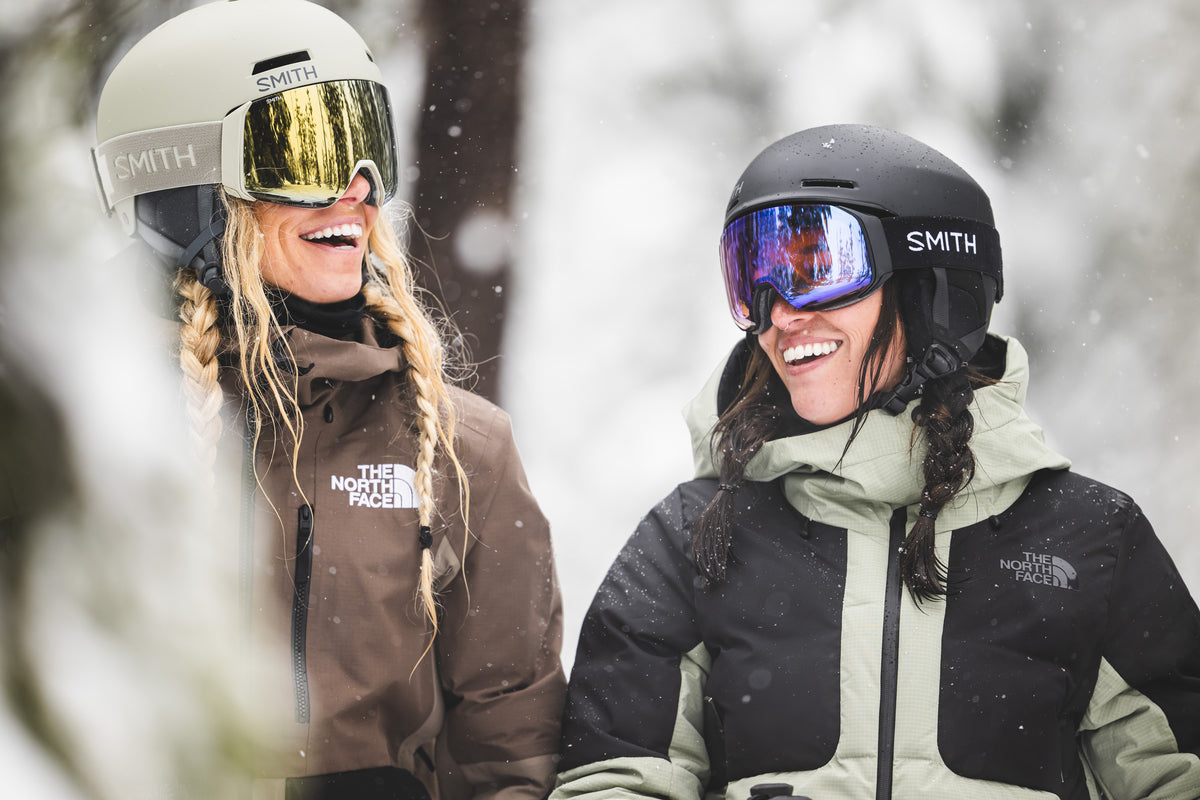Skiers wearing Smith helmets and goggles on a snowy day at Mt. Bachelor. Photo: Darcy Bacha / Smith