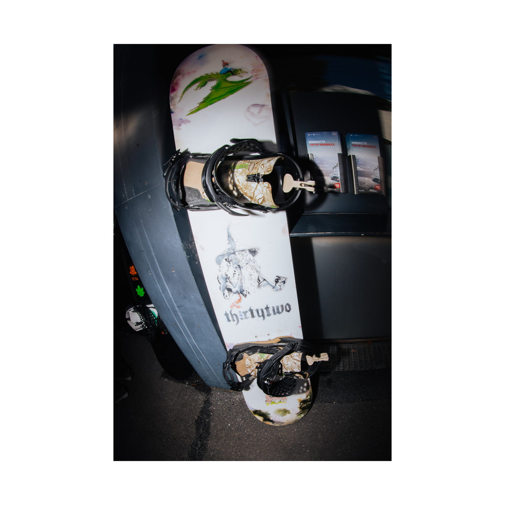 Middle Earth Pro snowboard topsheet and mounted bindings shown in full