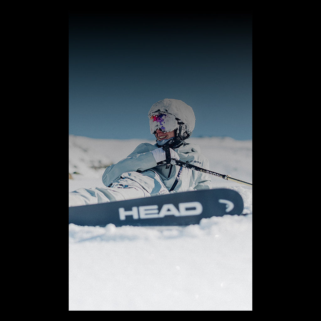 Tyrolia Attack LYT 11 GW — skier with HEAD skis in the mountains